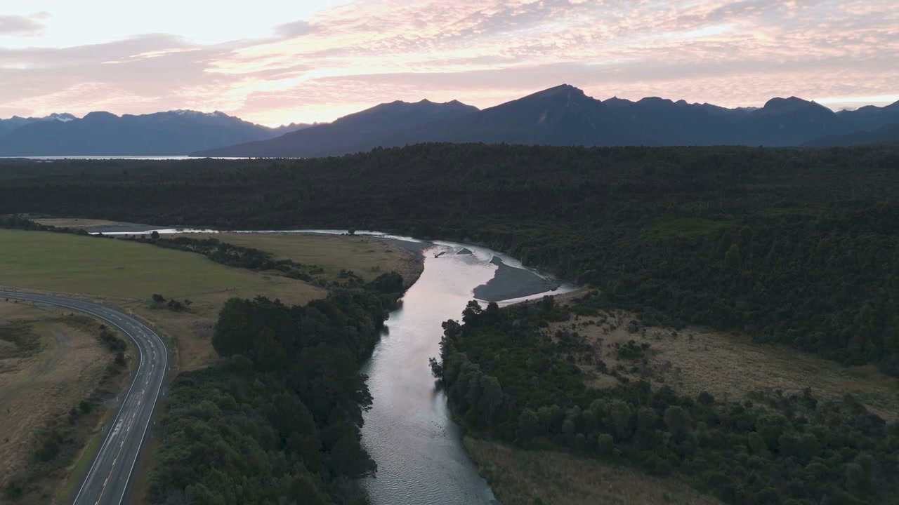 Scenic River Valley with Mountains at Sunset