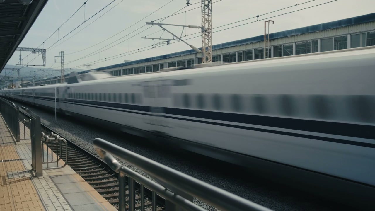 Bullet Train Passing Station in Japan