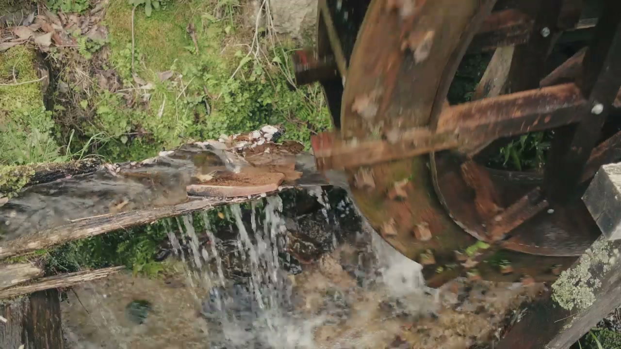 Old Wooden Water Wheel Spinning in Japan