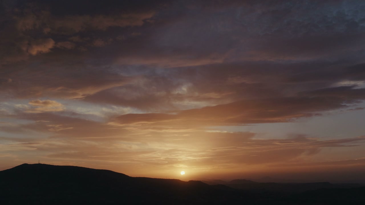 Dramatic Sunset Over Mountain Landscape