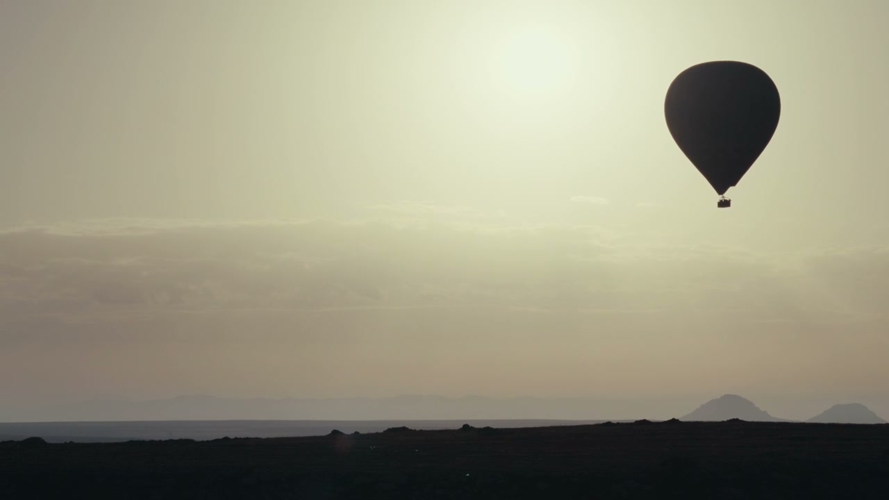 Hot Air Balloon Floating Over Cappadocia Landscape