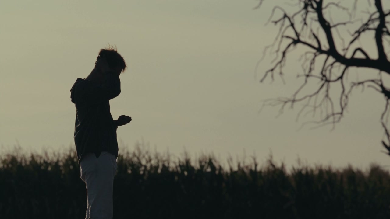 Young Man Looking Distraught at Sunset