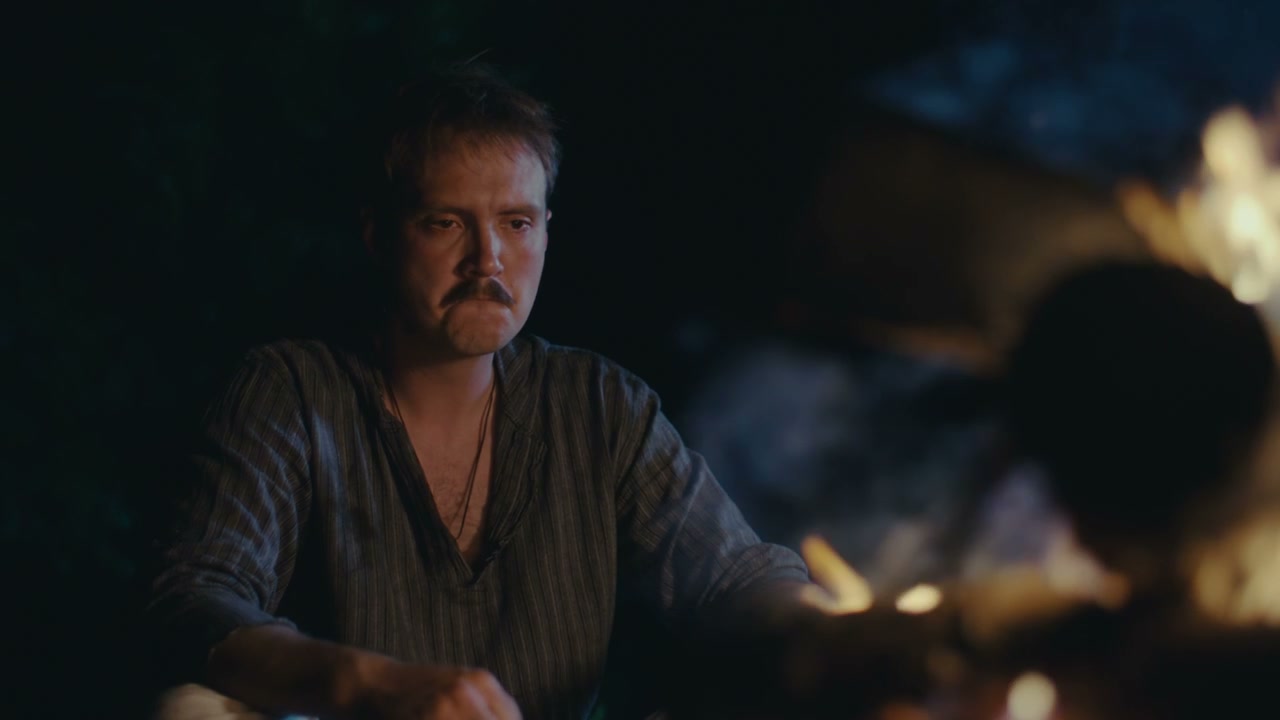 Contemplative Man by Campfire