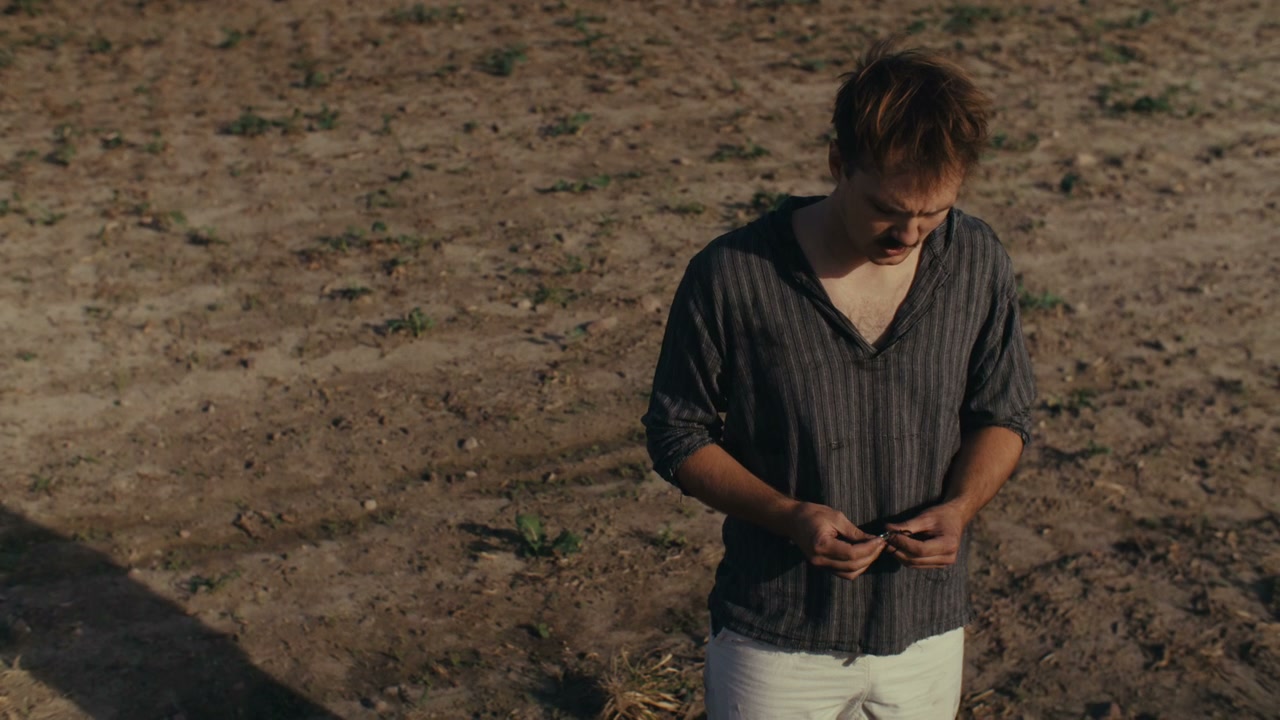 Heartbroken Man Standing in Field