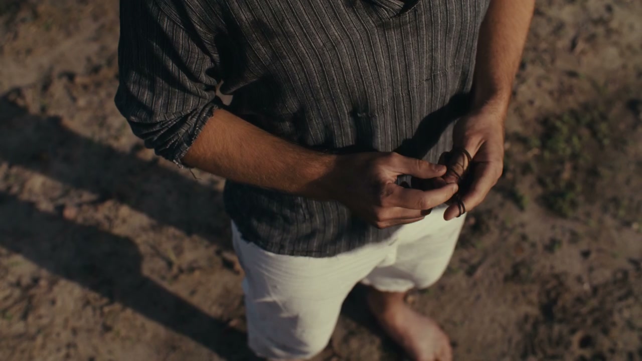 Contemplative Man Fidgeting Hands