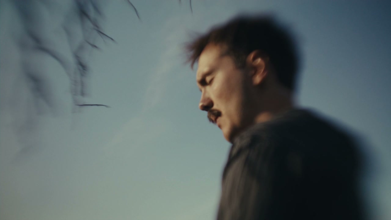 Pensive Man Looking Down Outdoors