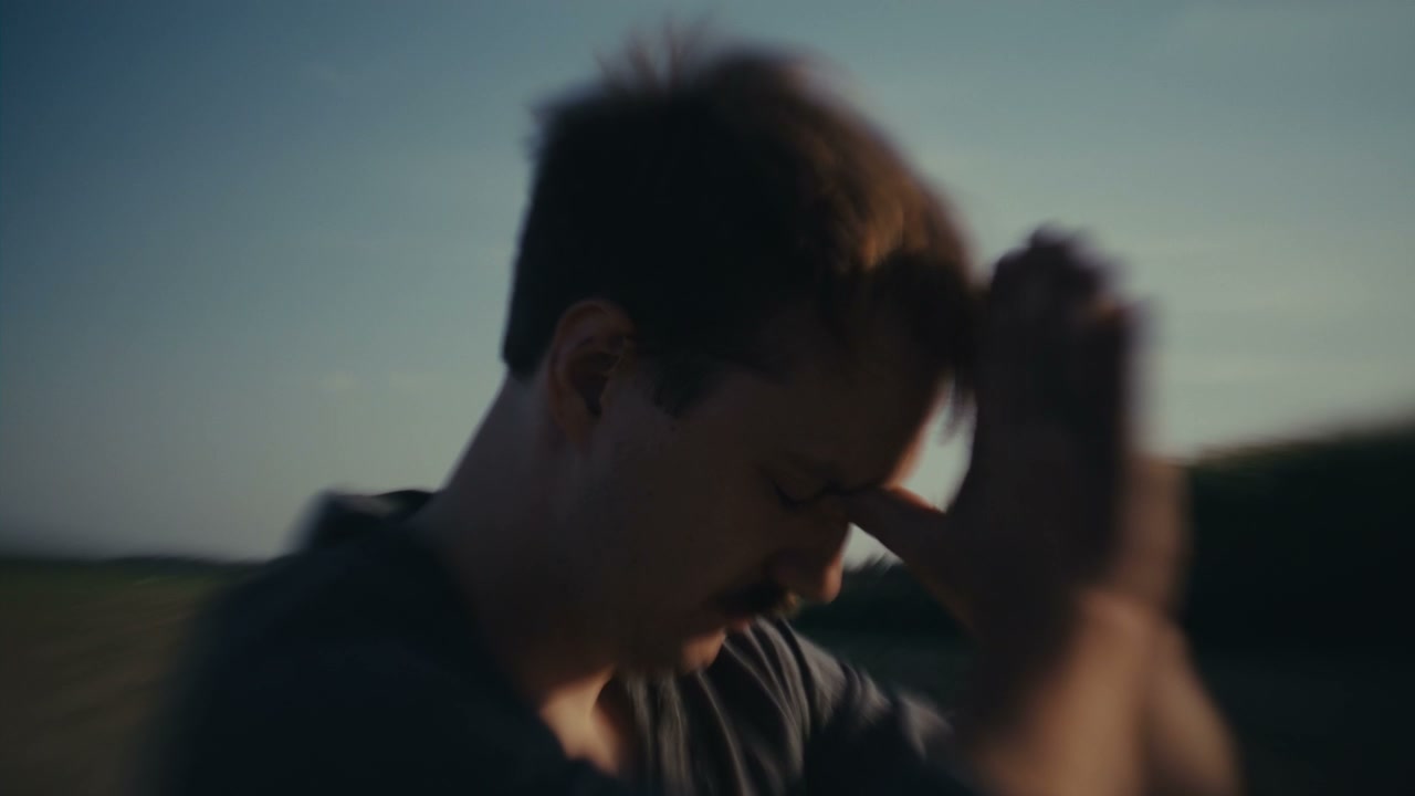 Distressed Man Reflecting Outdoors