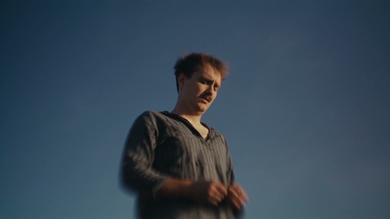 Emotional Man Looking Up at Sky