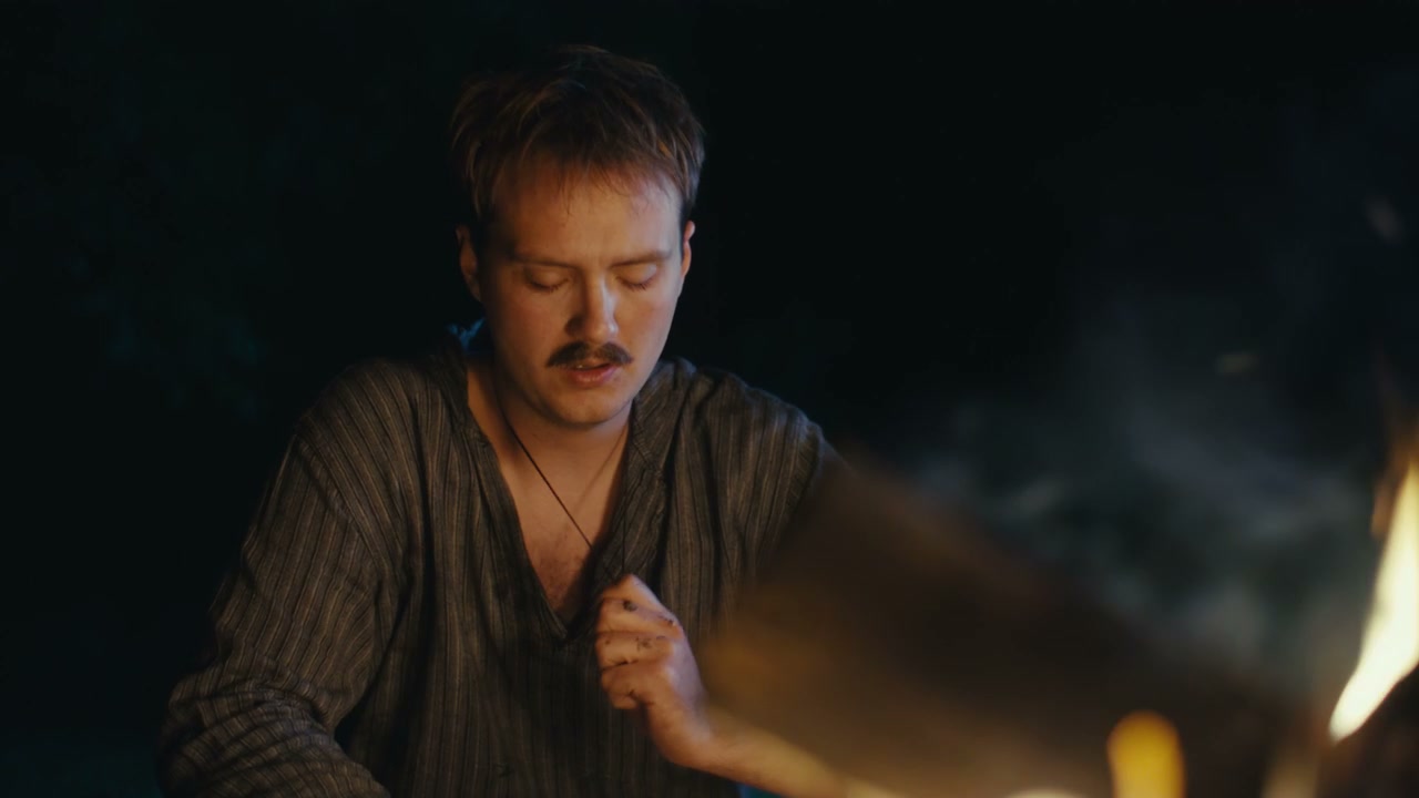 Thoughtful Man By Campfire At Night