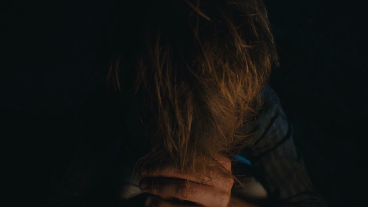 Heartbroken Man in Dim Light