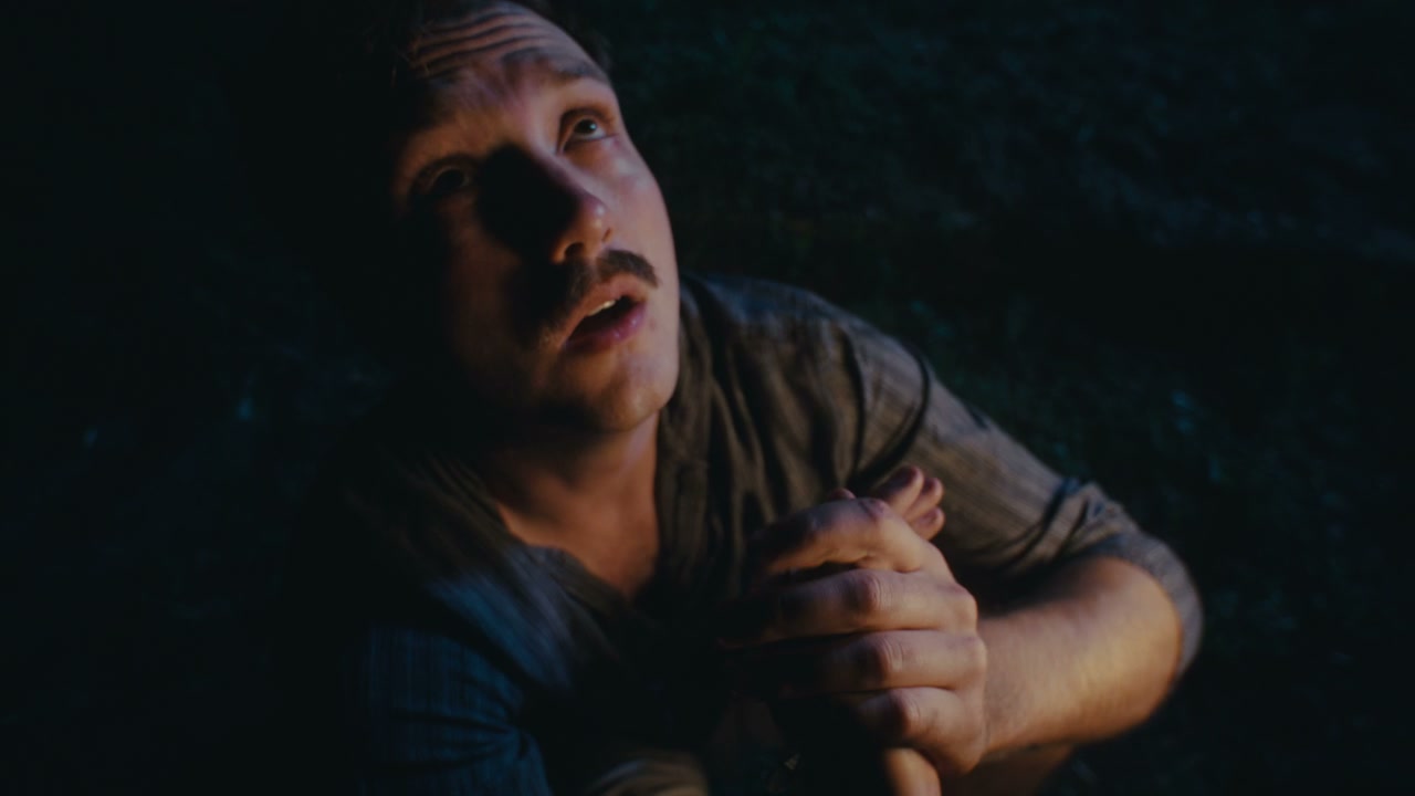 Man Looking Up in Despair at Night