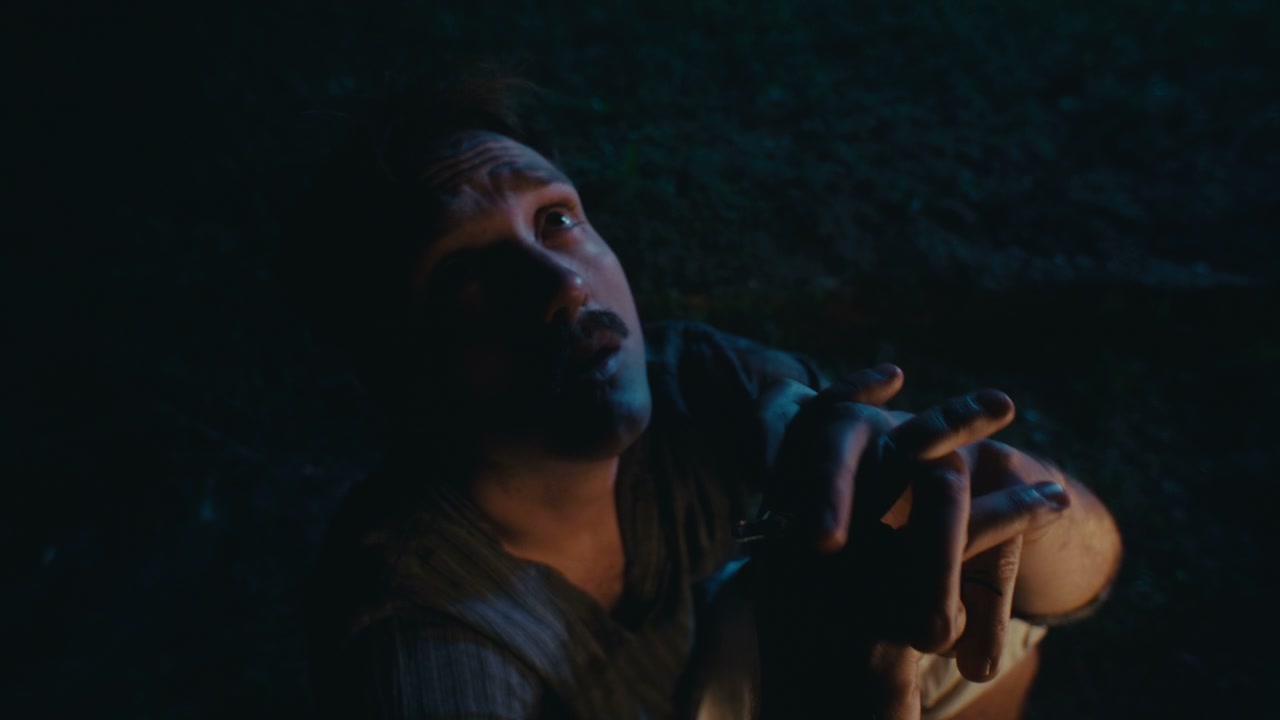 Distraught Man in Dark Setting