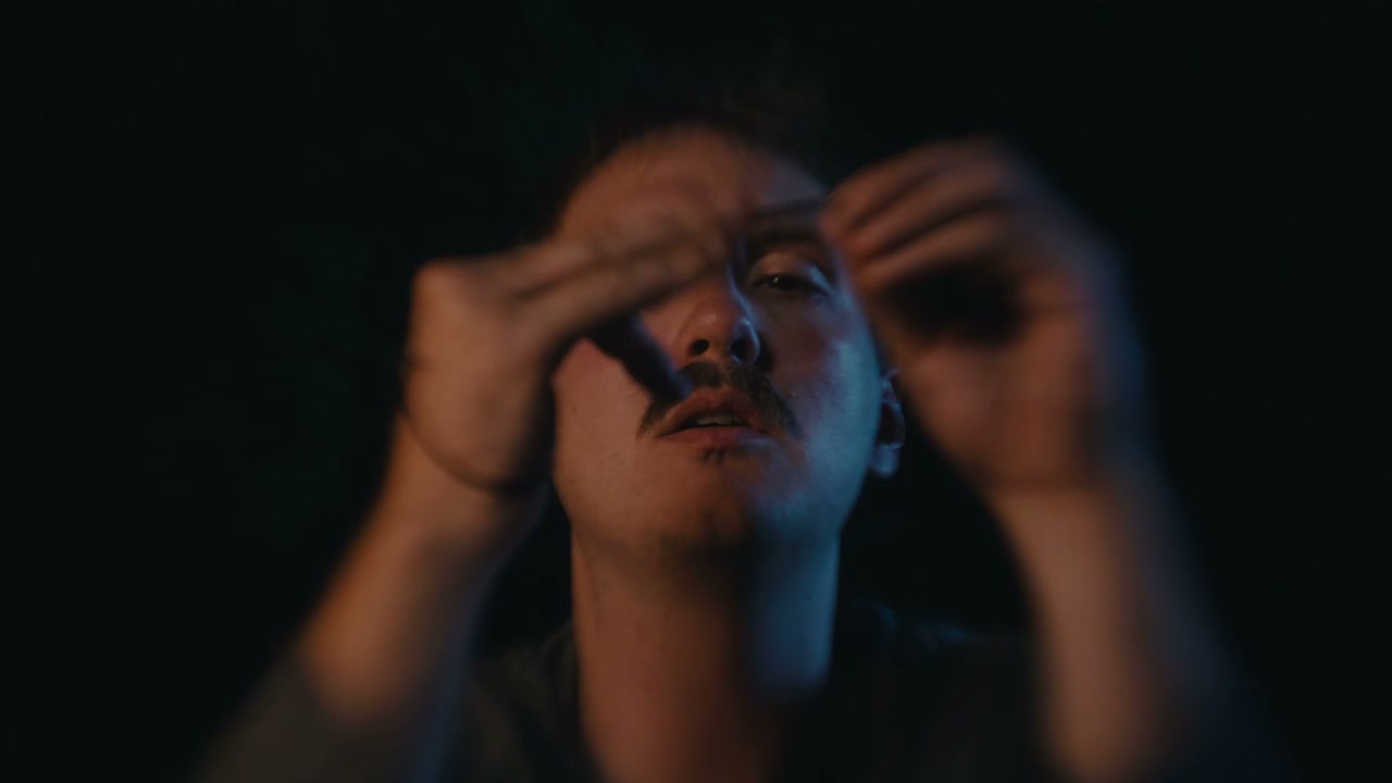 Heartbroken Man Playing with Elastic Band