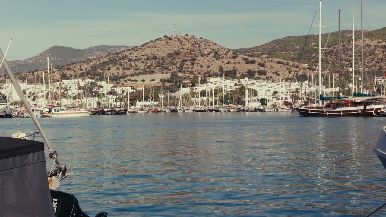 Sunny Harbor with Yachts and Coastal Town