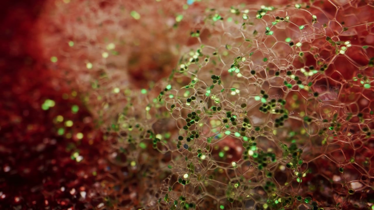 Glitter Particles in Foamy Liquid