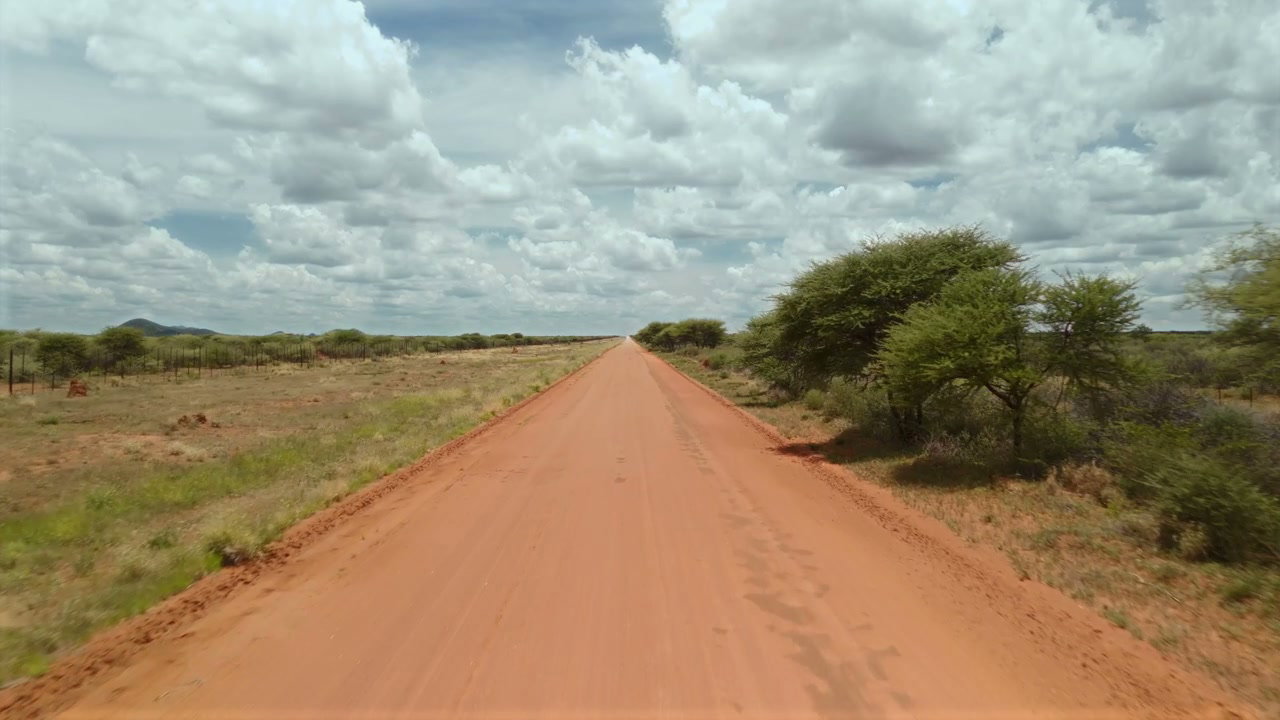 Straight Dirt Road in African Landscape