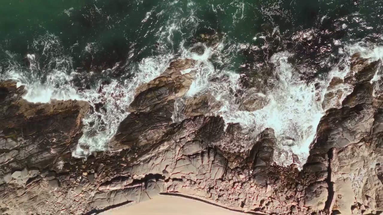 Ocean Waves Crashing on Rocky Coast