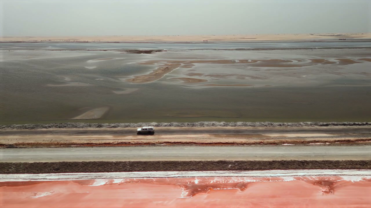 Car Driving Along Salt Pan Road