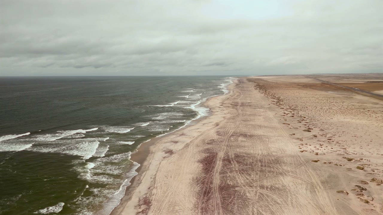 Vast Dusty Coastal Beach with Ocean Waves