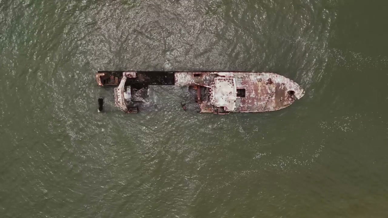 Aerial View of Rusty Shipwreck in Ocean