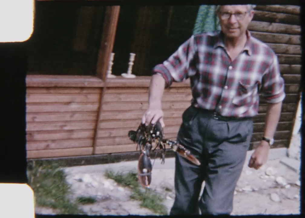 Man Holding Live Lobster Outdoors