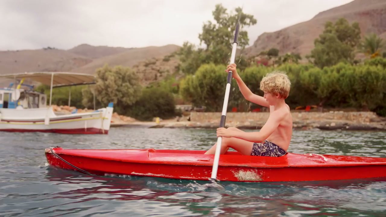 Young Boy Kayaking in Crete