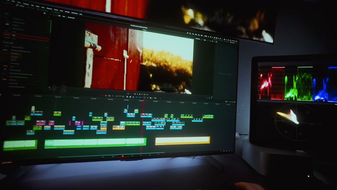 Person Editing Video on Multi-Monitor Setup • Stock Video on Uppbeat