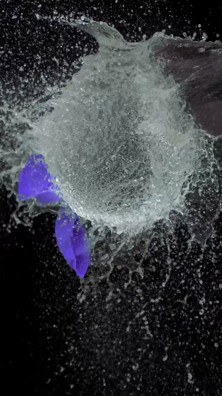 Water Balloon Bursts on Badminton Racket • Stock Video on Uppbeat