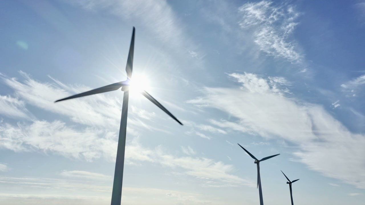 Rotating Wind Turbine Against Grey Sky • Stock Video on Uppbeat