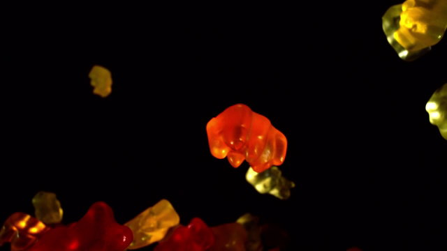 Vibrant Gummy Candies Falling in Slow Motion • Stock Video on Uppbeat