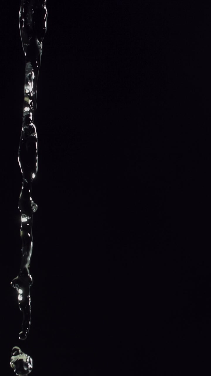 Clear Water Stream on Black Background