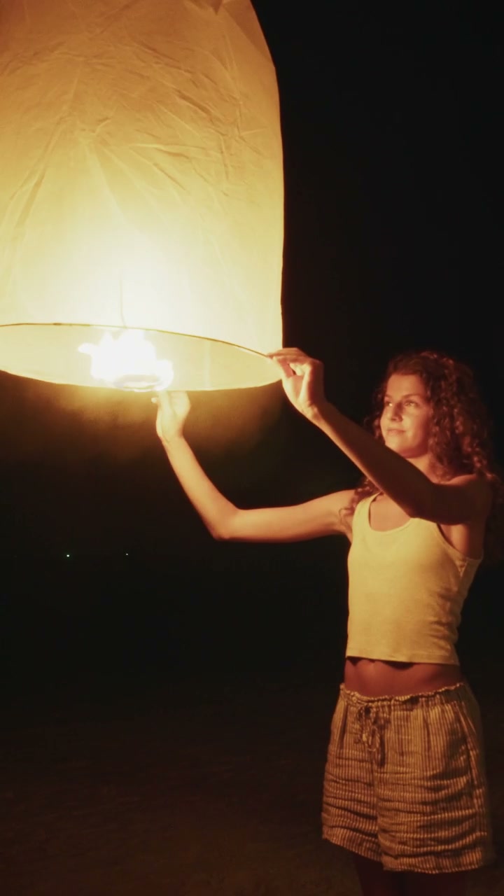 Young Person Holding Glowing Lantern