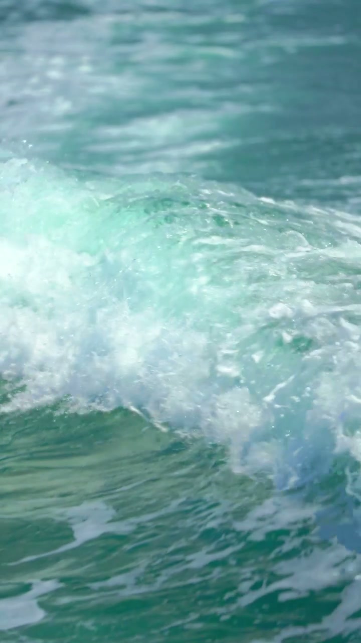 Turquoise Ocean Waves Breaking in Sunlight