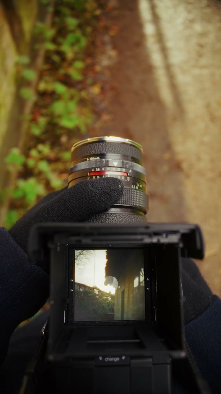 Photographer Manually Focusing a Vintage Film Camera • Stock Video on ...