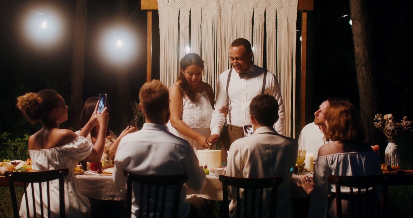 Couple Cutting Wedding Cake