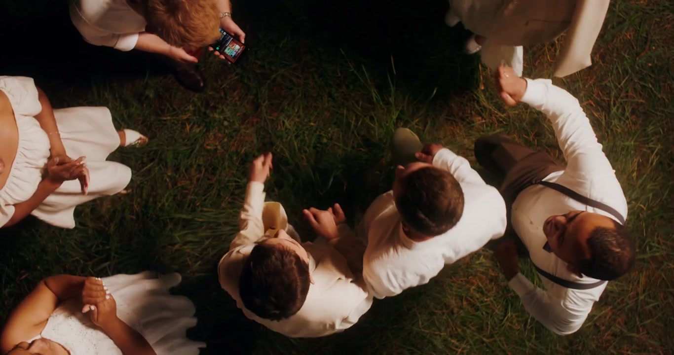 Overhead of Wedding Guests Dancing Outdoors
