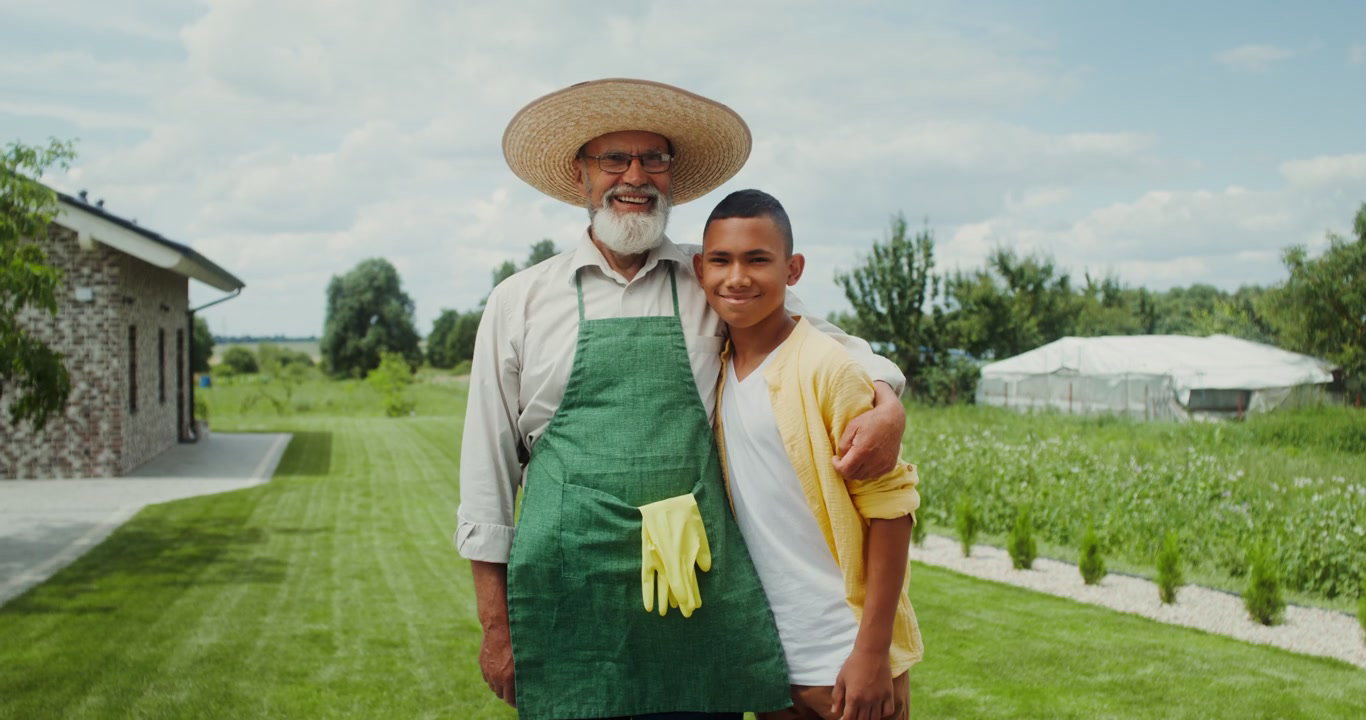 Grandfather and Grandson Smiling in Garden