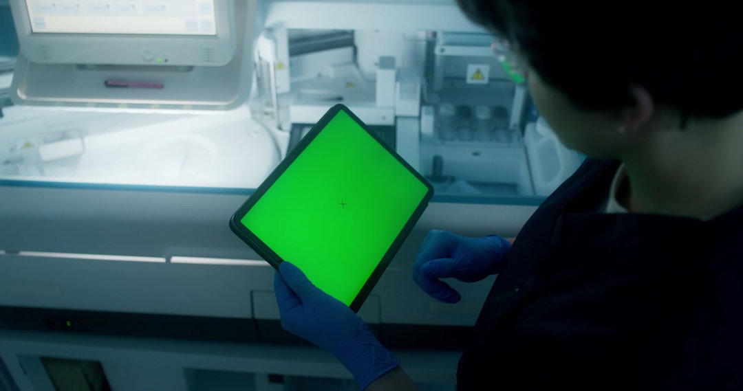 Scientist Using Green Screen Tablet in Lab • Stock Video on Uppbeat