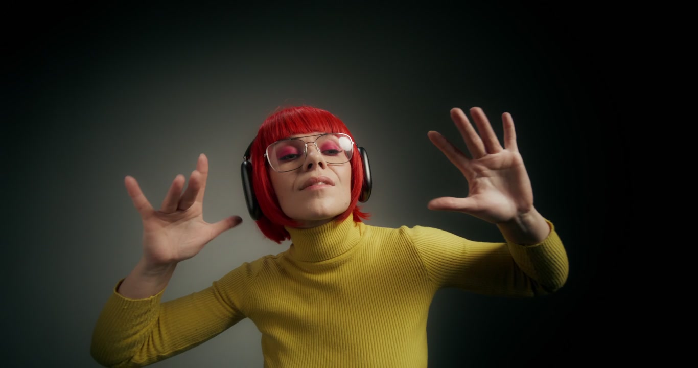Woman with Red Hair Dancing to Music
