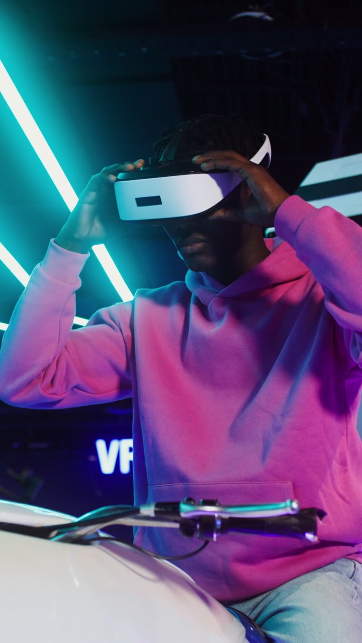 Young Gamer on VR Motorcycle Simulator