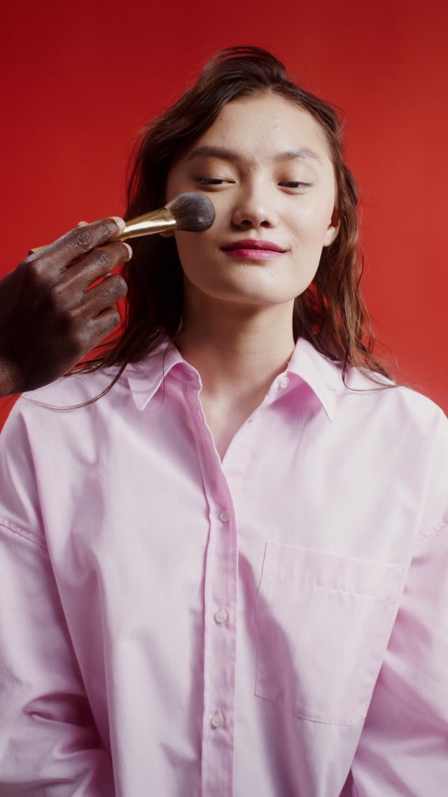 Woman Applying Face Powder • Stock Video on Uppbeat