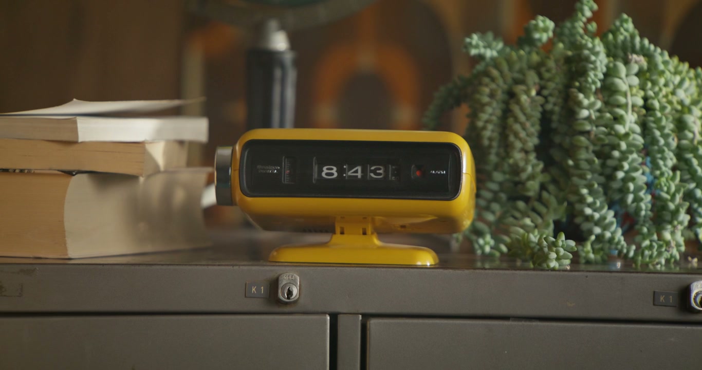 Retro Yellow Flip Clock on Filing Cabinet