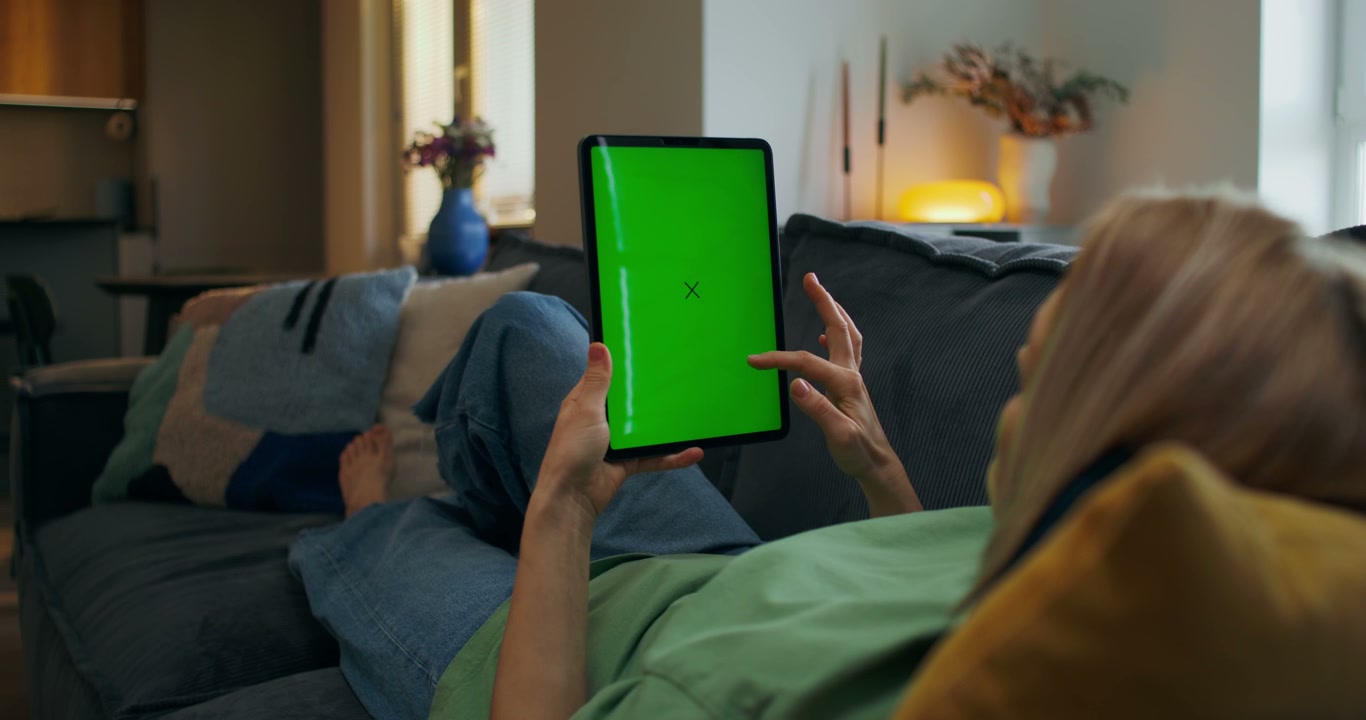 Woman Scrolling Digital Tablet • Stock Video on Uppbeat