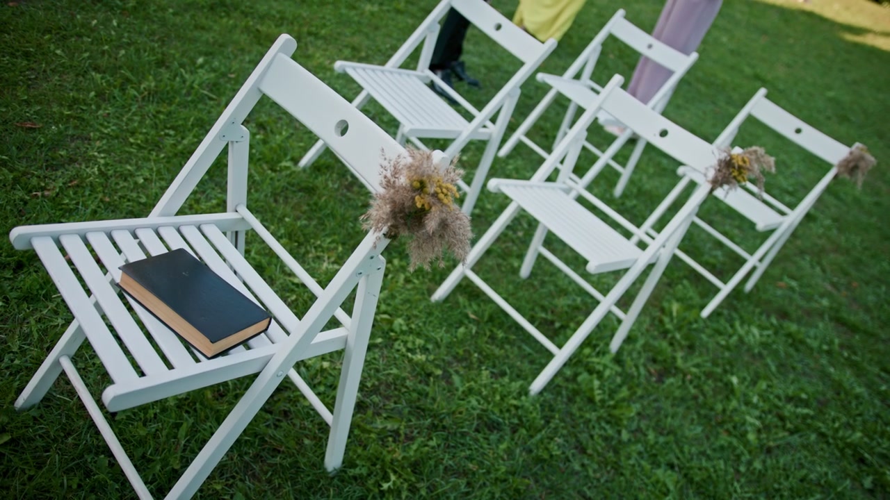 Chairs on Green Lawn with Book