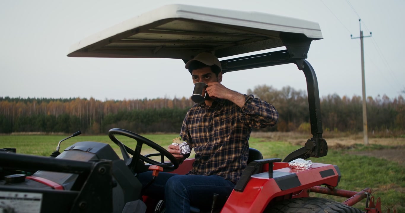 Farmer Taking a Lunch Break in Field