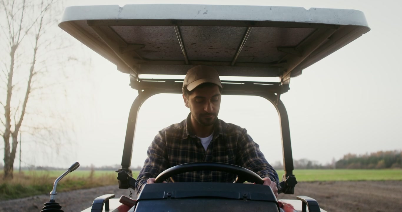 Farmer Getting into Tractor