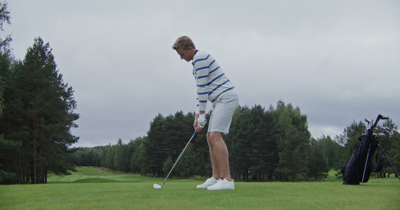 Man Performing Golf Swing