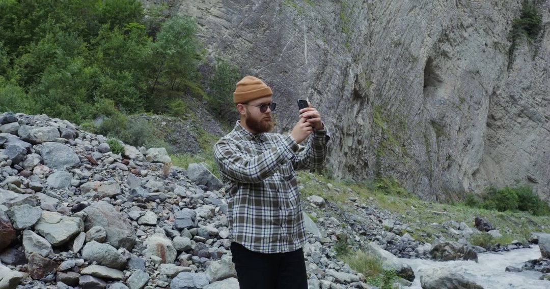 Man in White Hooded Robe with Arms Outstretched • Stock Video on Uppbeat