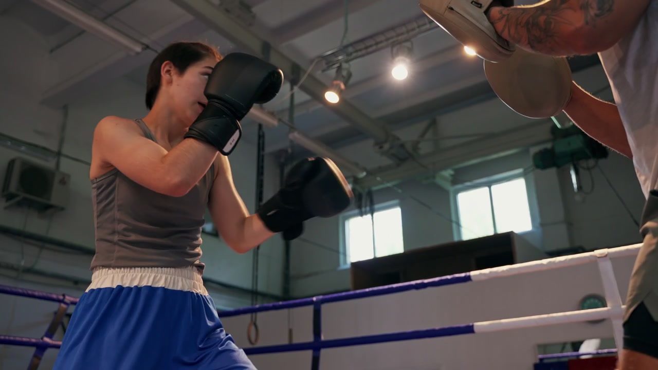 Boxer Shadow Boxing with Dumbbells in Ring • Stock Video on Uppbeat