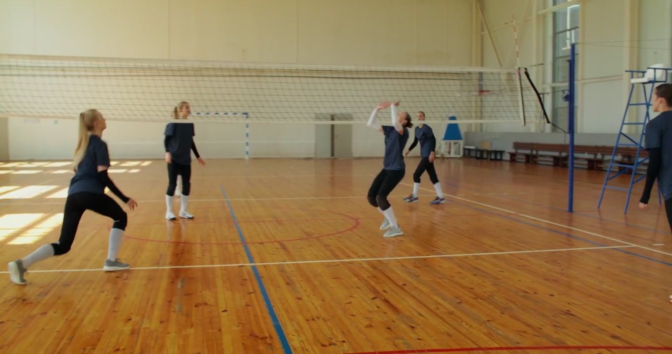 Female Volleyball Team Plays and Celebrates